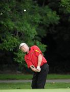 2 July 2010; Former Dublin footballer Barney Rock, from Stabannon Gaels GAA Club, pitches onto the first green during the FBD All-Ireland GAA Golf Challenge 2010 Leinster Final. Palmerstown House Golf Club, Co. Kildare. Picture credit: Matt Browne / SPORTSFILE