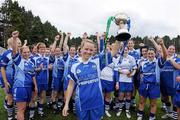 3 July 2010; Waterford captain Mary Foley lifts the cup as her team-mates celebrate. TG4 Ladies Football Munster Intermediate Championship Final, Waterford v Limerick, Castletownroche GAA Grounds, Castletownroche, Co. Cork. Picture credit: Matt Browne / SPORTSFILE