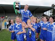 3 July 2010; Waterford captain Mary Foley is lifted by team-mates Grainne Enright and Grainne Keneally. TG4 Ladies Football Munster Intermediate Championship Final, Waterford v Limerick, Castletownroche GAA Grounds, Castletownroche, Co. Cork. Picture credit: Matt Browne / SPORTSFILE