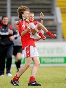 4 July 2010; Moy Davitts, Mayo, player Maks Babianwyk lifts team-mate Michael Guilfoyle after beating Stradbally, Laois, in the Division 2 Boys Final. Coca-Cola GAA Féile Peil na nÓg Finals 2010, Celtic Park, Derry. Photo by Sportsfile