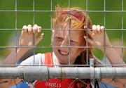 4 July 2010; Vanessa McHugh, Lifford, watches the remaining competitors after she was knocked out of the U12 Girl's Long Jump, during the Woodie's DIY AAI Juvenile Track & Field Championships. Tullamore Harriers Stadium, Tullamore, Co. Offaly. Picture credit: Brian Lawless / SPORTSFILE
