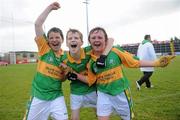 4 July 2010; Gortletteragh, Leitrim, players, Shane Keigheran, left, James Heslin and Keoghan McGovern, right, celebrate after beating  Robertstown, Kildare, in the Division 6 Boys Final. Coca-Cola GAA Féile Peil na nÓg Finals 2010, Celtic Park, Derry. Photo by Sportsfile