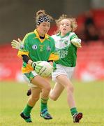 4 July 2010; Karen O'Leary, Monagea, Limerick, in action against Louise Gillanders, St. Laurence O'Tooles, Dublin, during the Division 2 Girls Final. Coca-Cola GAA Féile Peil na nÓg Finals 2010, Celtic Park, Derry. Photo by Sportsfile
