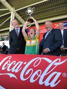 4 July 2010; Claregalway, Galway, captain Anna Goldrick lifts the cup, alongside Pat Quill, President, Cumann Peil Gael na mBan and John Coffey, Coca Cola promotions manager, after beating St. Laurences, Kildare in the Division 1 Girls Final. Coca-Cola GAA Féile Peil na nÓg Finals 2010, Celtic Park, Derry. Photo by Sportsfile