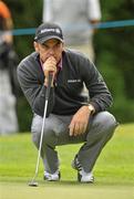 5 July 2010; Paul McGinley lines up his putt on the 17th green during the JP McManus Invitational Pro-Am. Adare Manor, Adare, Co. Limerick. Picture credit: Diarmuid Greene / SPORTSFILE