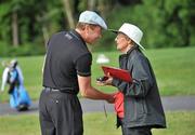 5 July 2010; Michael Flatley is greeted by official Helen Roche from Newcastlewest, Co. Limerick, at the 14th green. JP McManus Invitational Pro-Am. Adare Manor, Adare, Co. Limerick. Picture credit: Diarmuid Greene / SPORTSFILE