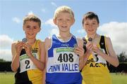 4 July 2010; Winnner of the U12 Boy's 600m Denver Kelly, Finn Valley, centre, with second place Luke Fitzsimons, Kilkenny City Harriers, left, and third place Alan Monaghan, Bohermeen, during the Woodie's DIY AAI Juvenile Track & Field Championships. Tullamore Harriers Stadium, Tullamore, Co. Offaly. Picture credit: Brian Lawless / SPORTSFILE