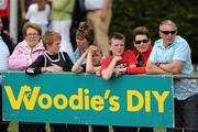 4 July 2010; Athletics fans keep an eye on the action, during the Woodie's DIY AAI Juvenile Track & Field Championships. Tullamore Harriers Stadium, Tullamore, Co. Offaly. Picture credit: Brian Lawless / SPORTSFILE
