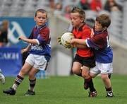 6 July 2010; Jake Kirwan, Na Fianna, Co. Offaly, in action against Dylan Farrell, right, and Óisin Ryan, Tang/Maryland, Co. Westmeath during the ‘Play & Stay with the GAA’ Activity Days. Croke Park, Dublin. Picture credit: Barry Cregg / SPORTSFILE
