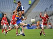 6 July 2010; David Corcoran, Annanough, Co. Laois, gets his shot away despite the efforts of Brian McGrath, left and Liam Burke, Coralstown, Co. Westmeath, during the ‘Play & Stay with the GAA’ Activity Days. Croke Park, Dublin. Picture credit: Barry Cregg / SPORTSFILE