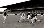 1960; Ollie Ryan, Louth, gets ready to pass the ball to Stephen White. Leinster Senior Football Championship Final, Offaly v Louth, Croke Park, Dublin. Picture credit: Connolly Collection / SPORTSFILE