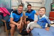 9 June 2016; Dublin Footballer Ciarán Kilkenny and Hurler Cian Boland met Kyron Walsh, aged 5, from Finglas West, Co. Dublin, in Temple Street Children’s University Hospital today as they delivered 100 Dublin jerseys on behalf of Dublin sponsors AIG Insurance to some of their biggest fans. Temple Street Children's University Hospital, Dublin. Photo by Stephen McCarthy/Sportsfile