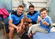 9 June 2016; Dublin Footballer Ciarán Kilkenny and Hurler Cian Boland met Kyron Walsh, aged 5, from Finglas West, Co. Dublin, in Temple Street Children’s University Hospital today as they delivered 100 Dublin jerseys on behalf of Dublin sponsors AIG Insurance to some of their biggest fans. Temple Street Children's University Hospital, Dublin. Photo by Stephen McCarthy/Sportsfile