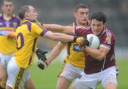 10 July 2010; Sean Armstrong, Galway, in action against Colm Morris and Joey Wadding, Wexford. GAA Football All-Ireland Senior Championship Qualifier, Round 2, Galway v Wexford, Pearse Stadium, Galway. Picture credit: Ray Ryan / SPORTSFILE