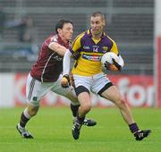 10 July 2010; Mattie Forde, Wexford, in action against Sean Armstrong, Galway. GAA Football All-Ireland Senior Championship Qualifier, Round 2, Galway v Wexford, Pearse Stadium, Galway. Picture credit: Ray Ryan / SPORTSFILE