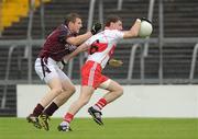 10 July 2010; Gerard O'Kane, Derry, in action against Kieran Martin, Westmeath. GAA Football All-Ireland Senior Championship Qualifier, Round 2, Westmeath v Derry, Cusack Park, Mullingar, Co. Westmeath. Photo by Sportsfile