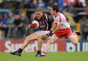 10 July 2010; Paul Greville, Westmeath, in action against Dermot McBride, Derry. GAA Football All-Ireland Senior Championship Qualifier, Round 2, Westmeath v Derry, Cusack Park, Mullingar, Co. Westmeath. Photo by Sportsfile