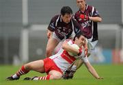 10 July 2010; Kevin McGuckin, Derry, in action against Conor Lynam, Westmeath. GAA Football All-Ireland Senior Championship Qualifier, Round 2, Westmeath v Derry, Cusack Park, Mullingar, Co. Westmeath. Photo by Sportsfile