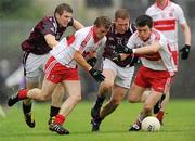 10 July 2010; Raymond Wilkinson and Dermot McBride, right, Derry, in action against Kieran Martin, left, and Paul Greville, Westmeath. GAA Football All-Ireland Senior Championship Qualifier, Round 2, Westmeath v Derry, Cusack Park, Mullingar, Co. Westmeath. Photo by Sportsfile