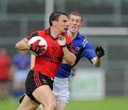 10 July 2010; Daniel Hughes, Down, in action against Seamus Hannon, Longford. GAA Football All-Ireland Senior Championship Qualifier, Round 2, Down v Longford, Pairc Esler, Newry, Co. Down. Picture credit: Oliver McVeigh / SPORTSFILE