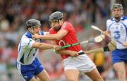 11 July 2010; Sean Óg Ó hAilpín, Cork, in action against Eoin McGrath, Waterford. Munster GAA Hurling Senior Championship Final, Cork v Waterford, Semple Stadium, Thurles, Co. Tipperary. Picture credit: Ray McManus / SPORTSFILE