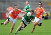 11 July 2010; Brian Cox, Fermanagh, in action against Paul Duffy, Armagh. GAA Football All-Ireland Senior Championship Qualifier Round 2, Fermanagh v Armagh, Brewster Park, Enniskillen, Co. Fermanagh. Picture credit: Oliver McVeigh / SPORTSFILE