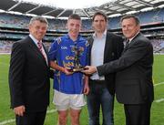 11 July 2010; Longford's Robert Smith who was presented with the ESB Leinster GAA Football Minor Championship Final Man of the Match award by Martin Skelly, left, vice-chairman Leinster Council, Paul Clancy, Safety Manager, ESBI and Peter McKenna, Croke park Stadium Director, right. ESB Leinster GAA Football Minor Championship Final, Offaly v Longford, Croke Park, Dublin. Photo by Sportsfile