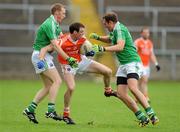 11 July 2010;Joe Feeney, Armagh, in action against Tommy McElroy and Ryan Carson, Fermanagh. GAA Football All-Ireland Senior Championship Qualifier Round 2, Fermanagh v Armagh, Brewster Park, Enniskillen, Co. Fermanagh. Picture credit: Oliver McVeigh / SPORTSFILE