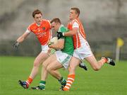 11 July 2010; Martin McGrath, Fermanagh, in action against Charlie Vernon and Gareth Swift, Armagh. GAA Football All-Ireland Senior Championship Qualifier Round 2, Fermanagh v Armagh, Brewster Park, Enniskillen, Co. Fermanagh. Picture credit: Oliver McVeigh / SPORTSFILE