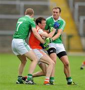 11 July 2010; Joe Feeney, Armagh, in action against Tommy McElroy and Ryan Carson, Fermanagh. GAA Football All-Ireland Senior Championship Qualifier Round 2, Fermanagh v Armagh, Brewster Park, Enniskillen, Co. Fermanagh. Picture credit: Oliver McVeigh / SPORTSFILE