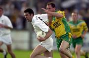 30 June 2001; Dermot Earley of Kildare in action against Noel McGinley of Donegal during the Bank of Ireland All-Ireland Championship Qualifier match between Kildare and Donegal at St Conleths Park in Newbridge, Kildare. Photo by Damien Eagers/Sportsfile