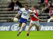30 June 2001; John Paul Mone, Monaghan, in action against Armagh's John McEntee. Monaghan v Armagh, Bank of Ireland Ulster Senior Football Championship Qualifier, St. Tighearnach's Park, Clones, Co. Monaghan. Picture credit; David Maher / SPORSTFILE *EDI*