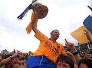1 July 2001; Roscommon captain Fergal O'Donnell celebrates with fans following the Bank of Ireland Connacht Senior Football Championship Final match between Roscommon and Mayo at Dr. Hyde Park in Roscommon. Photo by David Maher/Sportsfile