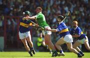 1 July 2001; Brian Begley of Limerick in action against David Kennedy, left, and Philip Maher of Tipperary during the Guinness Munster Senior Hurling Final match between Tipperary and Limerick at Páirc Uí Chaoimh in Cork. Photo by Damien Eagers/Sportsfile