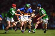 1 July 2001; Mark O'Leary of Tipperary in action against TJ Ryan, left, and Brian Geary of Limerick during the Guinness Munster Senior Hurling Final match between Tipperary and Limerick at Páirc Uí Chaoimh in Cork. Photo by Ray McManus/Sportsfile