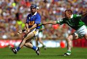 1 July 2001; Eoin Kelly of Tipperary in action against Mark Foley of Limerick during the Guinness Munster Senior Hurling Final match between Tipperary and Limerick at Páirc Uí Chaoimh in Cork. Photo by Ray McManus/Sportsfile