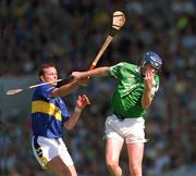 1 July 2001; Brian Geary of Limerick in action against Declan Ryan of Tipperary during the Guinness Munster Senior Hurling Final match between Tipperary and Limerick at Páirc Uí Chaoimh in Cork. Photo by Ray McManus/Sportsfile