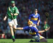 1 July 2001; Sean O'Connor of Limerick grabs hold fo Paul Ormonde of Tipperary during the Guinness Munster Senior Hurling Final match between Tipperary and Limerick at Páirc Uí Chaoimh in Cork. Photo by Ray McManus/Sportsfile