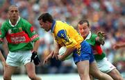 1 July 2001; Clifford McDonald of Roscommon in action against Marty McNicholas of Mayo during the Bank of Ireland Connacht Senior Football Championship Final match between Roscommon and Mayo at Dr. Hyde Park in Roscommon. Photo by David Maher/Sportsfile