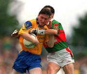 1 July 2001; Conor Connelly of Roscommon is tackled by Noel Connelly of Mayo during the Bank of Ireland Connacht Senior Football Championship Final match between Roscommon and Mayo at Dr. Hyde Park in Roscommon. Photo by David Maher/Sportsfile