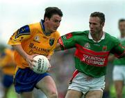 1 July 2001; Conor Connelly of Roscommon in action against Conor McManaman of Mayo during the Bank of Ireland Connacht Senior Football Championship Final match between Roscommon and Mayo at Dr. Hyde Park in Roscommon. Photo by David Maher/Sportsfile