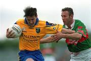 1 July 2001; Conor Connelly of Roscommon in action against Conor McManaman of Mayo during the Bank of Ireland Connacht Senior Football Championship Final match between Roscommon and Mayo at Dr. Hyde Park in Roscommon. Photo by David Maher/Sportsfile