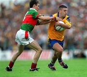 1 July 2001; Frankie Dolan of Roscommon is tackled by Ray Connelly of Mayo during the Bank of Ireland Connacht Senior Football Championship Final match between Roscommon and Mayo at Dr. Hyde Park in Roscommon. Photo by David Maher/Sportsfile