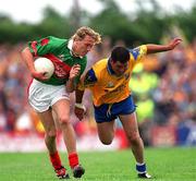 1 July 2001; Ciaran McDonald of Mayo in action against Francie Grehan of Roscommon during the Bank of Ireland Connacht Senior Football Championship Final match between Roscommon and Mayo at Dr. Hyde Park in Roscommon. Photo by David Maher/Sportsfile