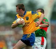 1 July 2001; Michael Ryan of Roscommon in action against Marty McNicholas of Mayo during the Bank of Ireland Connacht Senior Football Championship Final match between Roscommon and Mayo at Dr. Hyde Park in Roscommon. Photo by David Maher/Sportsfile