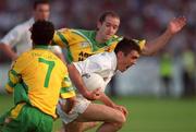 30 June 2001; John Doyle of Kildare in action against Damien Diver, left, and Eamon Doherty of Donegal during the Bank of Ireland All-Ireland Championship Qualifier match between Kildare and Donegal at St Conleths Park in Newbridge, Kildare. Photo by Damien Eagers/Sportsfile