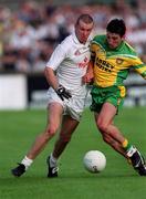 30 June 2001; Ronan Sweeney of Kildare in action against Michael Hegarty of Donegal during the Bank of Ireland All-Ireland Championship Qualifier match between Kildare and Donegal at St Conleths Park in Newbridge, Kildare. Photo by Damien Eagers/Sportsfile