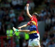 1 July 2001; Setanta O'hAilpin of Cork in action against Ger Griffin of Tipperary during the Guinness Munster Minor Hurling Championship Final match between Cork and Tipperary at Páirc Ui Chaoimh in Cork. Photo by Ray McManus/Sportsfile