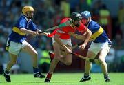 1 July 2001; Setanta O'hAilpin of Cork in action against Ger Griffin, left, and Pat Buckley of Tipperary during the Guinness Munster Minor Hurling Championship Final match between Cork and Tipperary at Páirc Ui Chaoimh in Cork. Photo by Ray McManus/Sportsfile