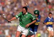 1 July 2001; Brian Begley of Limerick in action against David Kennedy of Tipperary during the Guinness Munster Senior Hurling Final match between Tipperary and Limerick at Páirc Uí Chaoimh in Cork. Photo by Ray McManus/Sportsfile